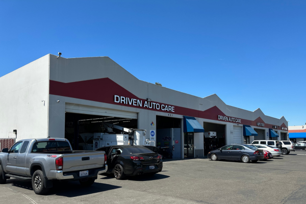 Auto Repair Shop in Fremont, CA with Driven Auto Care. External view of Driven Auto Care with parked cars in queue.