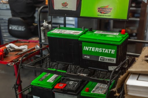 Ensure Your Toyota RAV4 Battery Performs Well in Cooler Weather with Driven Auto Care in Fremont and Campbell, CA. Image of interstate brand batteries displayed in the shop.